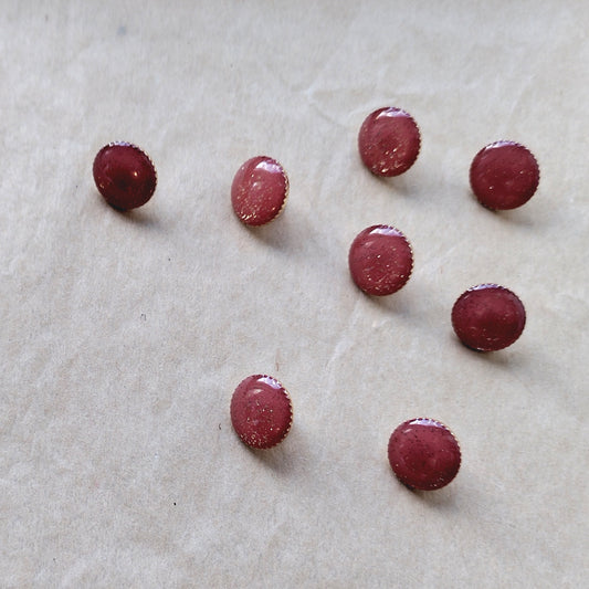 Guld glitrende knapper